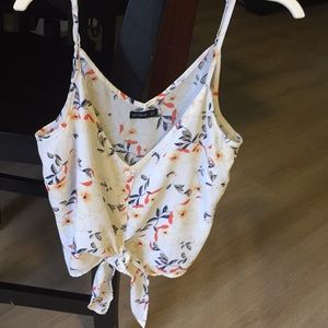 Spaghetti strap, flower shirt.